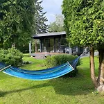 A Tiny House With A Garden And A Hot Tube