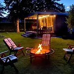 A Tiny House With A Garden And A Hot Tube Pringi