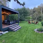 A Tiny House With A Garden And A Hot Tube