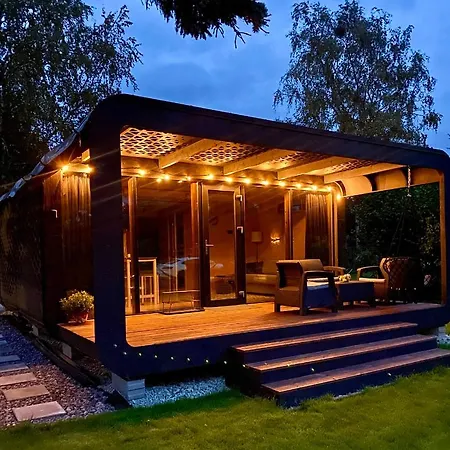 A Tiny House With A Garden And A Hot Tube