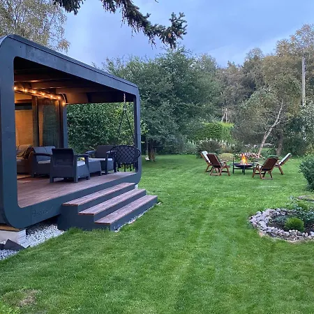 A Tiny House With A Garden And A Hot Tube