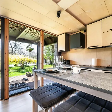 A Tiny House With A Garden And A Hot Tube Pringi