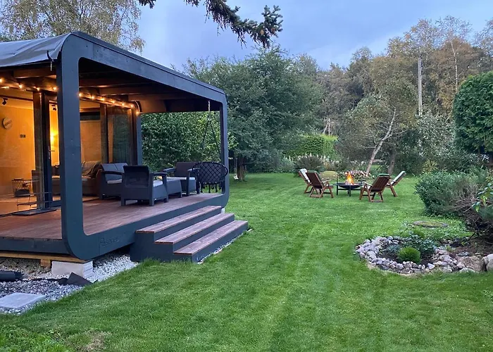 A Tiny House With A Garden And A Hot Tube